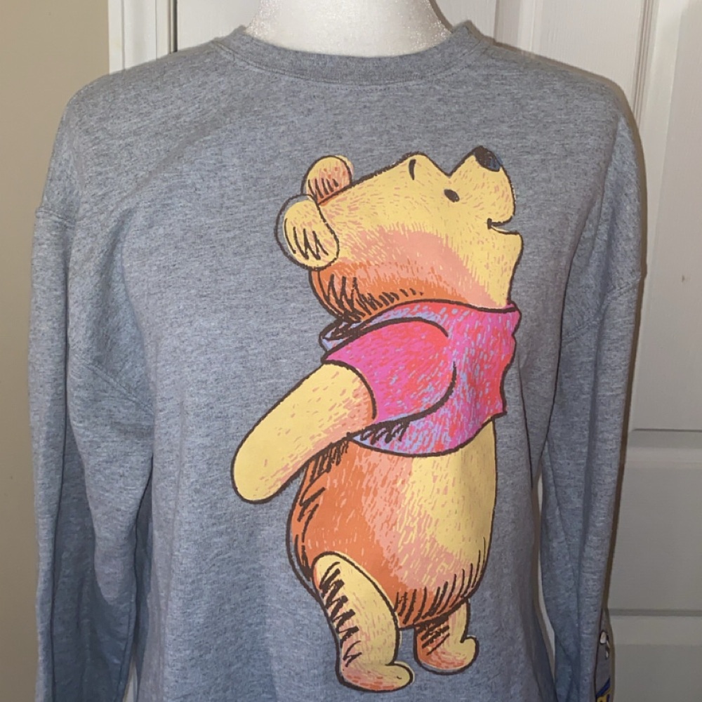 Grey Disney Winnie the Pooh Sweatshirt. Has details down sleeve.
